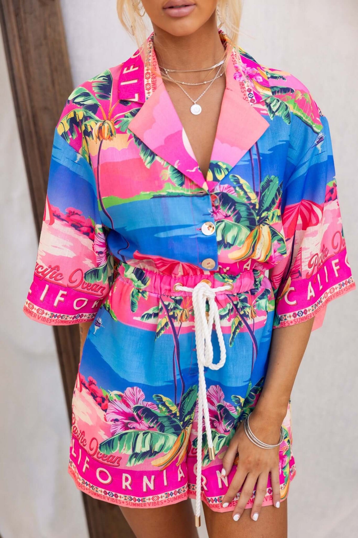 Colorful Holiday Mode Playsuit with buttons, drawstring waist, and pockets, ideal for a relaxed summer look.