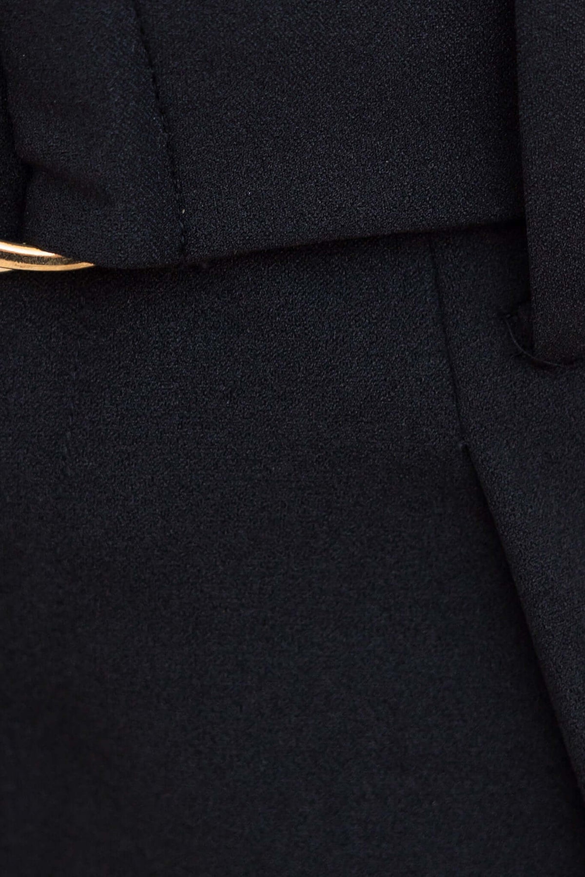 Close-up of the Huffington Pants featuring a removable belt and high waist fit in black fabric.