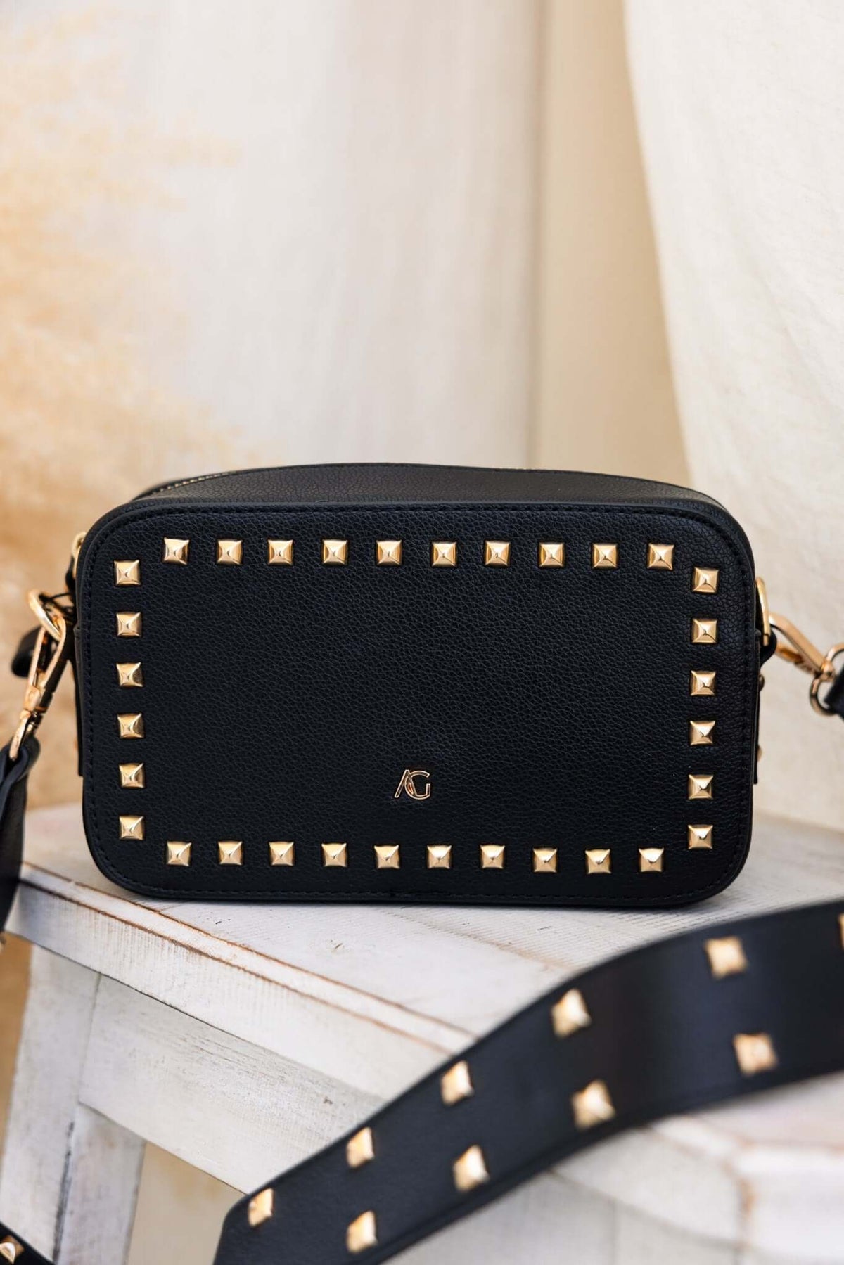 Veronica Crossbody Bag with metallic studs, perfect for essentials; stylish and compact for outings.