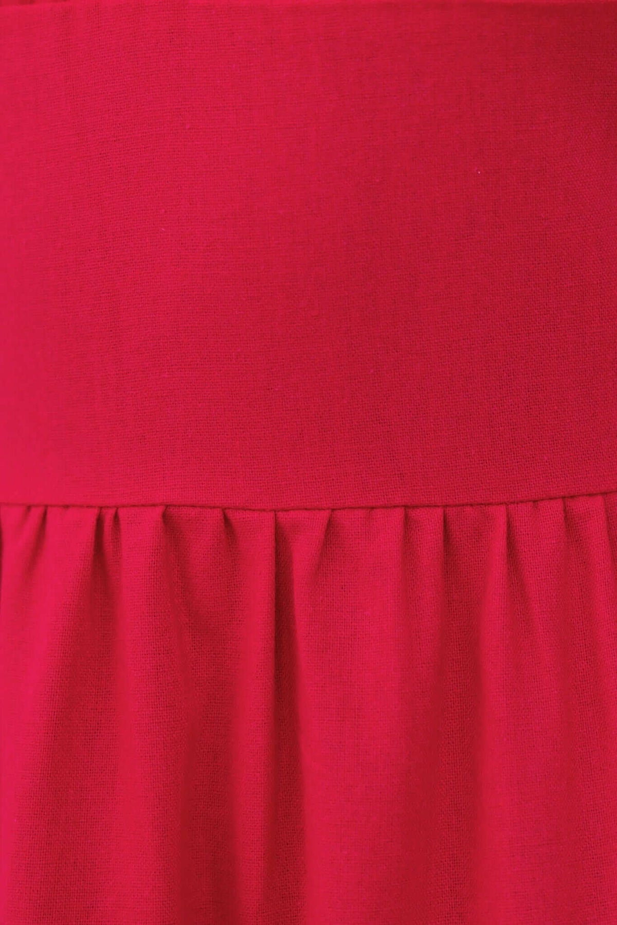 Close-up of Gresham Maxi Dress in vibrant red with a lined bust and gathered skirt detail.