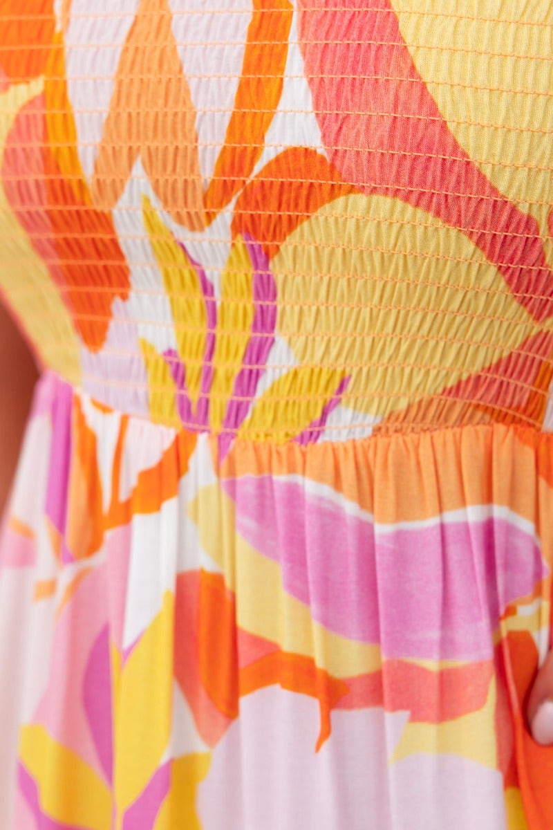 Close-up of the colorful bodice of the Island Cruise Midi Dress, featuring adjustable tie straps and elastic detailing.