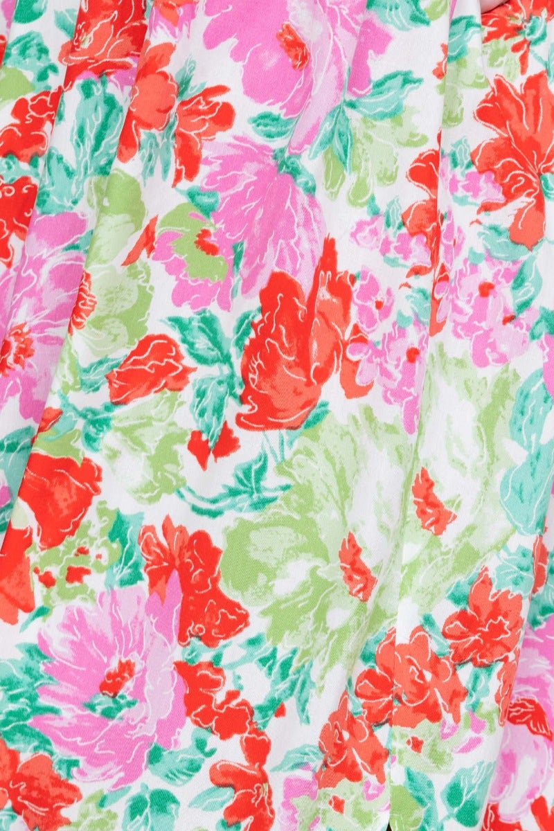 Floral print pattern featuring pink, red, and green flowers on white fabric, designed for the Swish Maxi Dress.