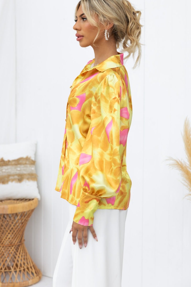 Indianna Top, satin feel shirt in vibrant yellow and pink with collar and button-up front, showcasing a relaxed fit.