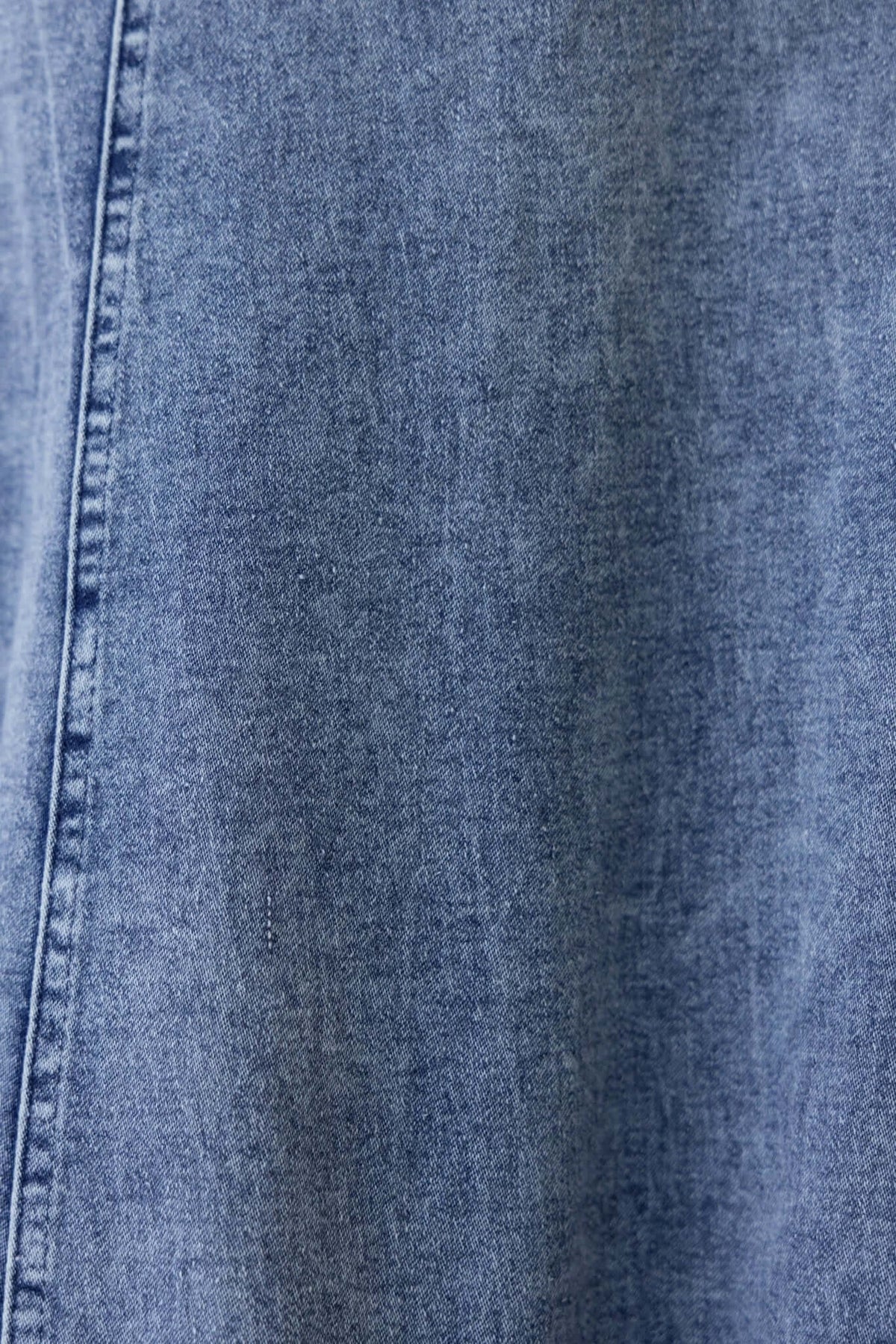 Close-up of Jacquie Denim Maxi Skirt fabric showing texture and color, emphasizing its soft denim material.