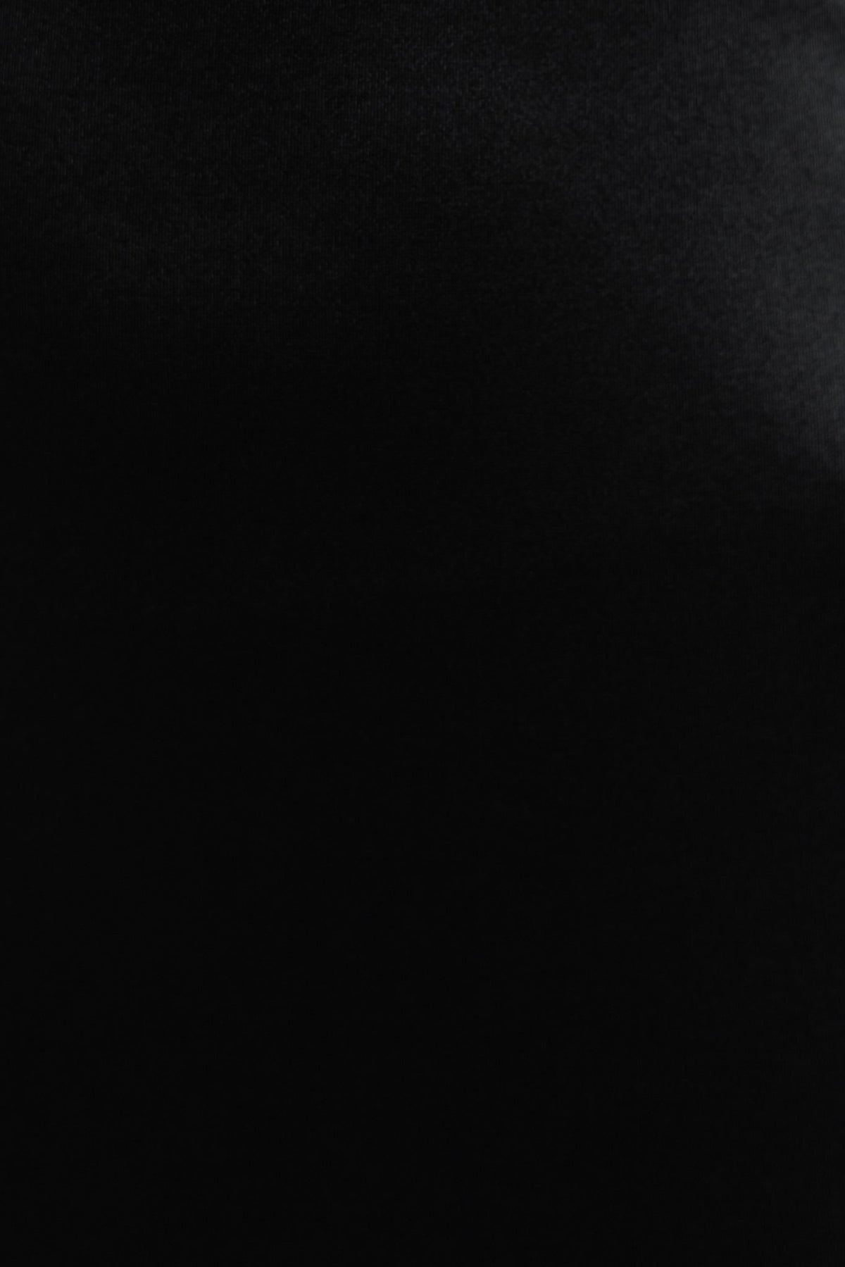 Close-up of black fabric texture featuring a smooth satin look, perfect for a stylish maxi dress.