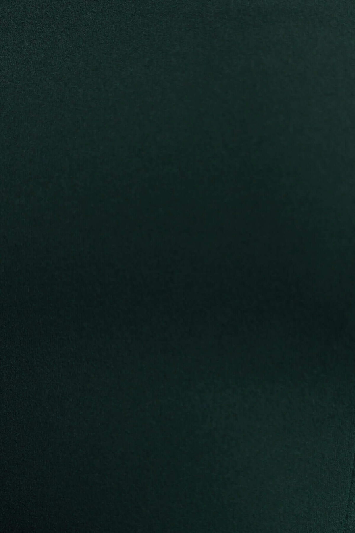 Close-up of dark green fabric showcasing the smooth texture of the Rios Midi Dress.
