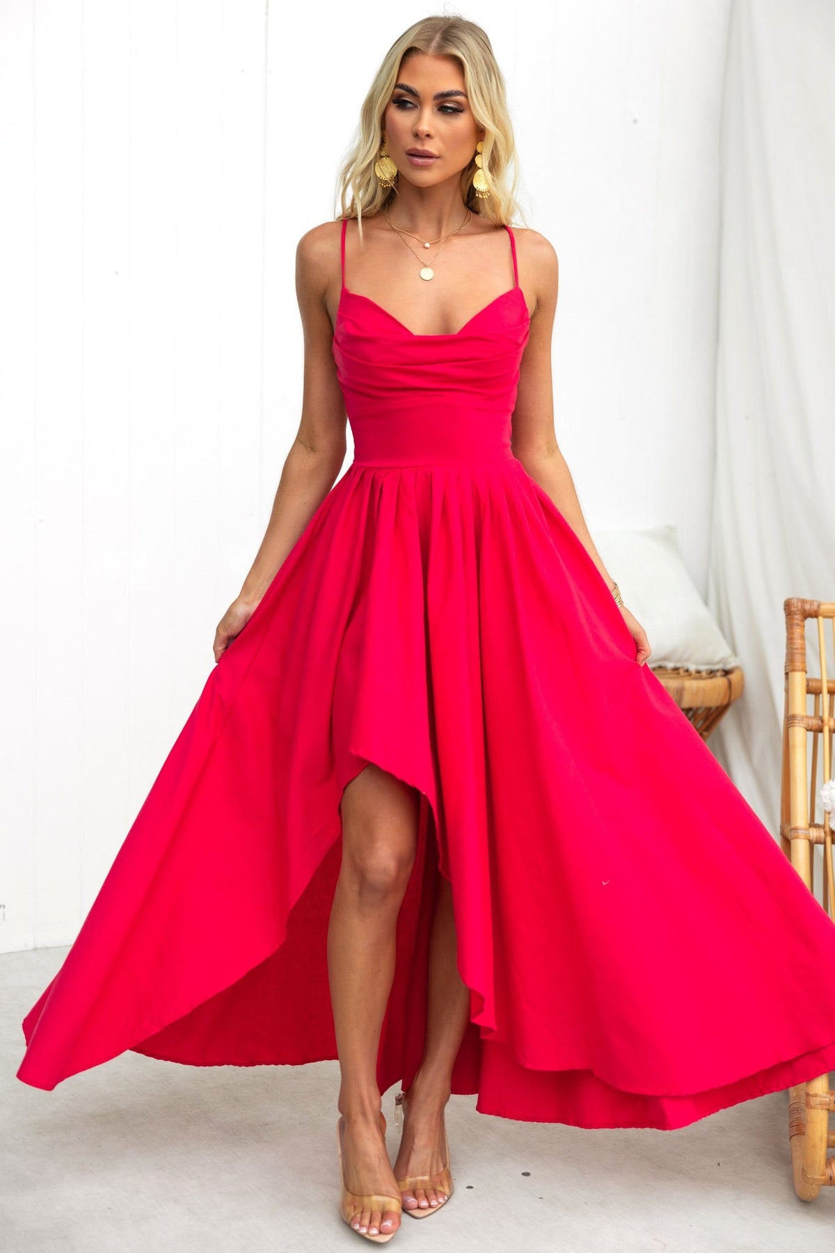 Adalita Maxi Dress in vibrant pink with adjustable straps, padded bust, and asymmetrical hemline, perfect for any occasion.