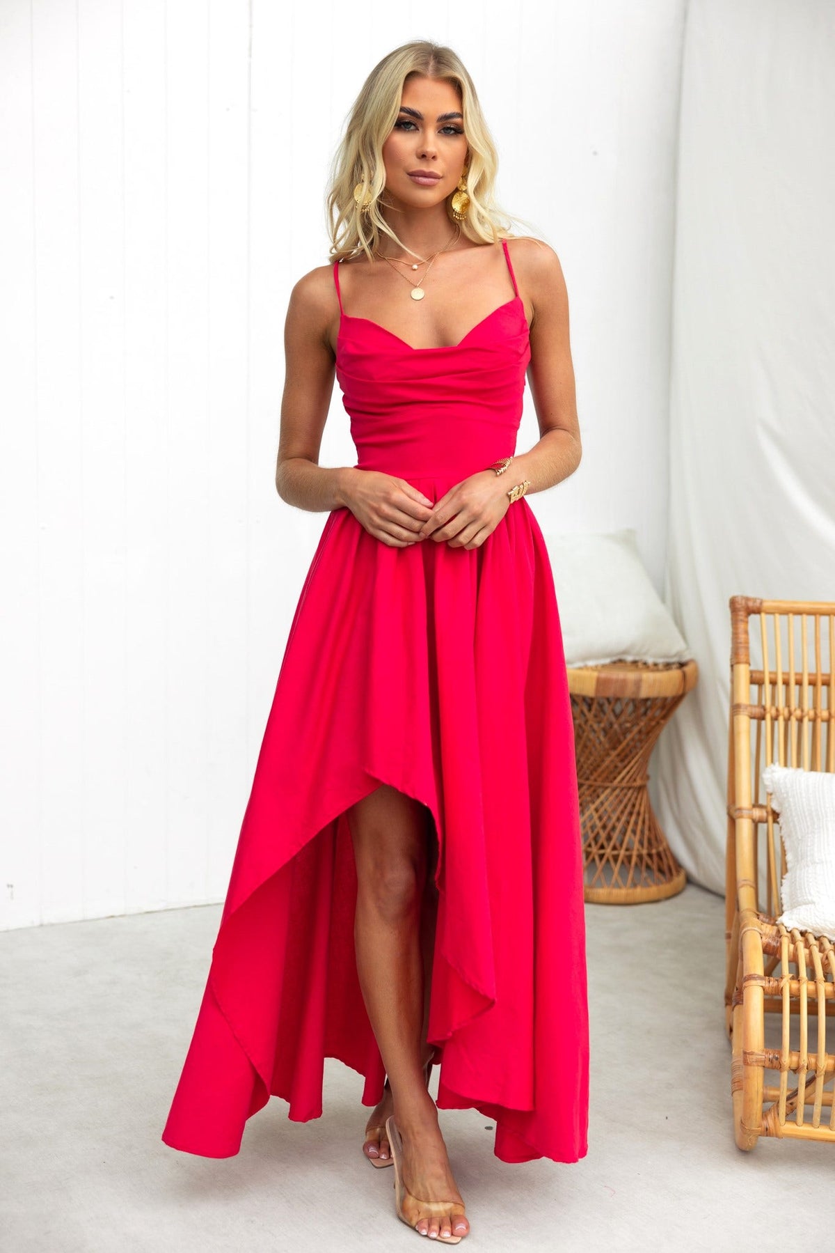 Adalita Maxi Dress in vibrant pink with adjustable straps, padded bust, and asymmetrical hemline, perfect for stylish occasions.