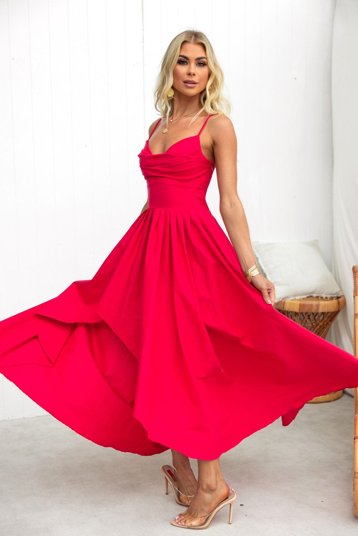 Adalita Maxi Dress in vibrant red with adjustable straps, padded bust, and flowing asymmetrical hemline.