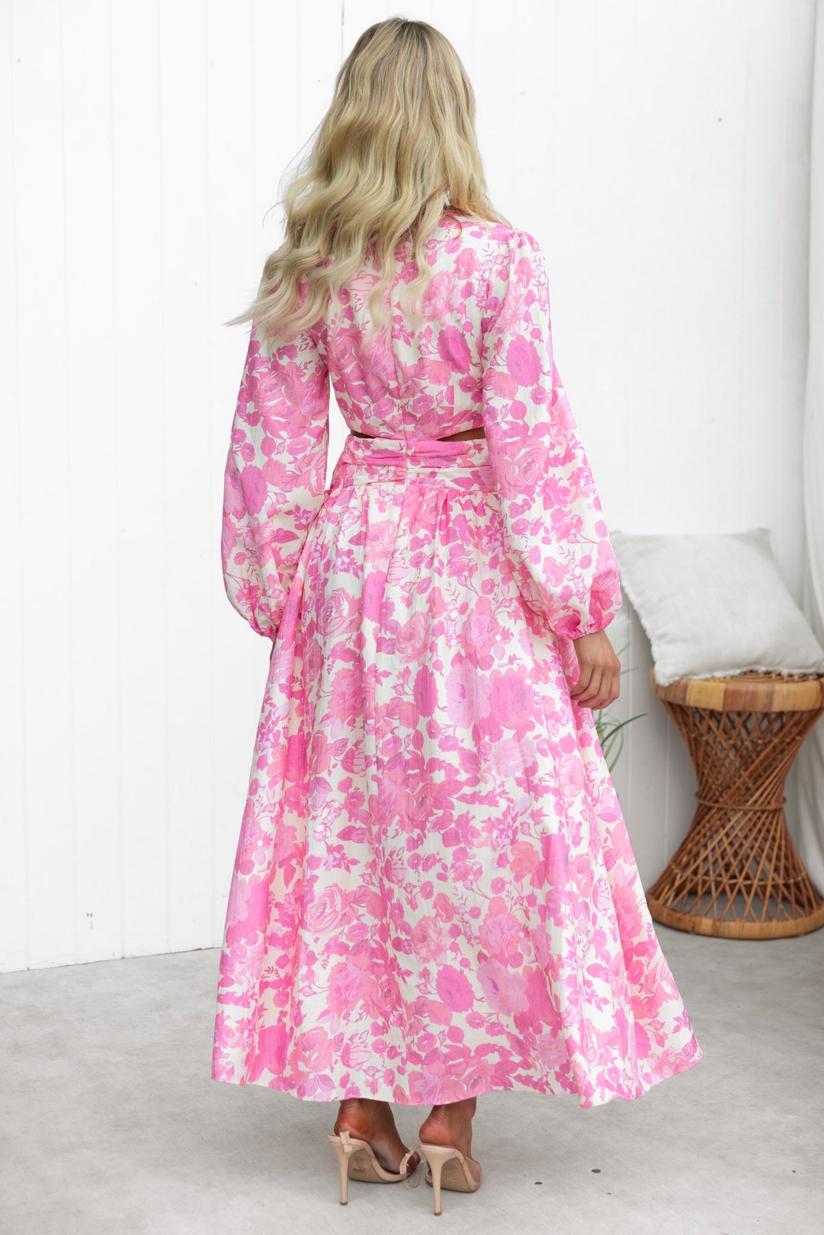 Back view of Just Joy Maxi Dress in pink floral print with long sleeves and cinched waist.