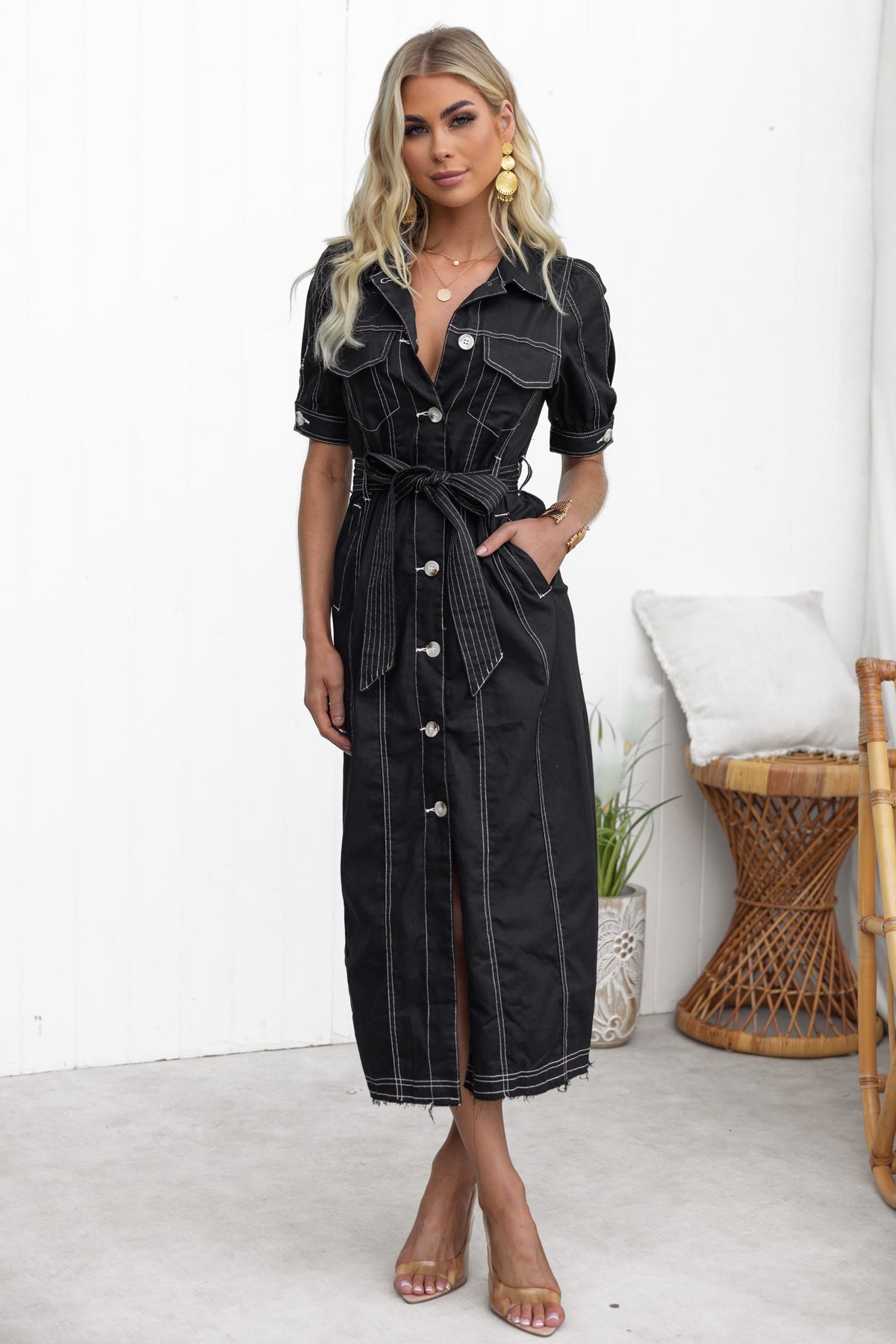 Morgan Denim Midi Dress in black with collar, button-up front, pockets, and removable belt, featuring a frayed hemline.