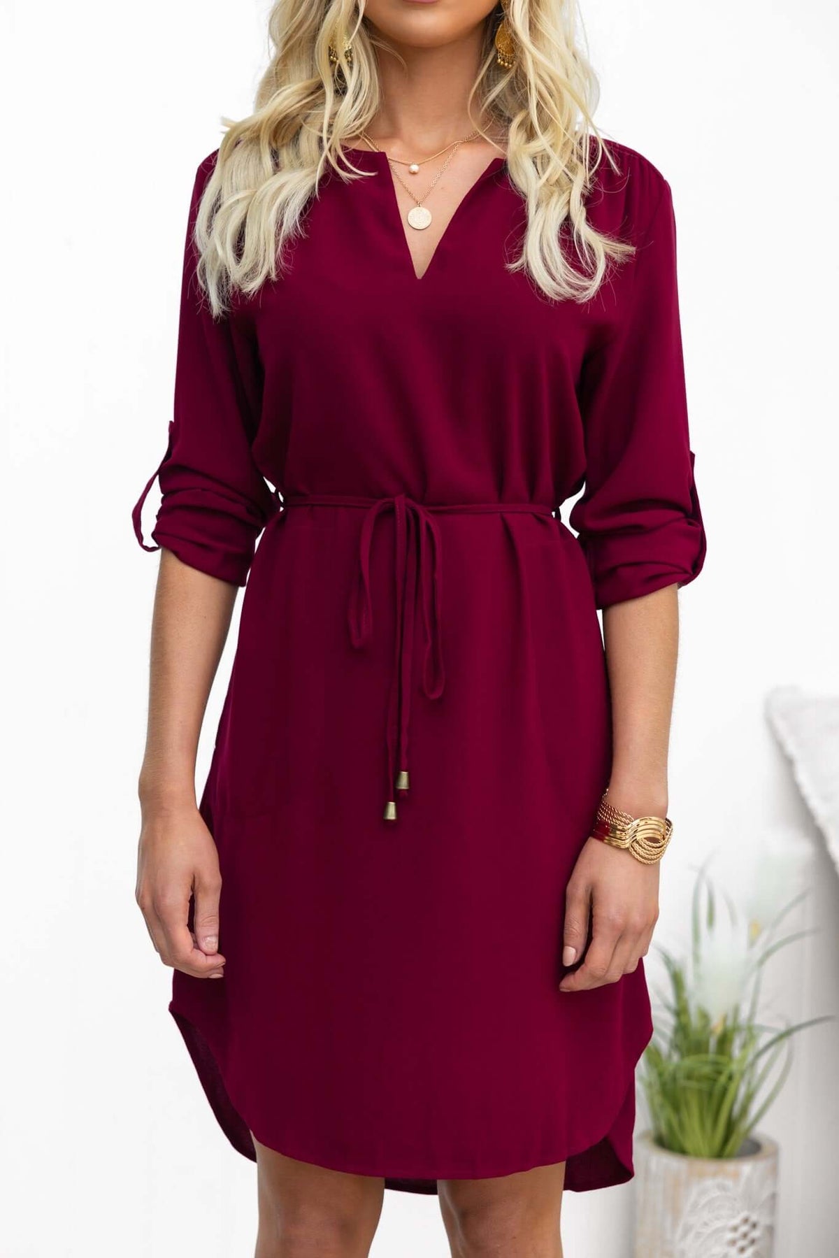 Stylish burgundy Deklyn dress featuring a V-neckline and removable tie, perfect for casual or semi-formal occasions.