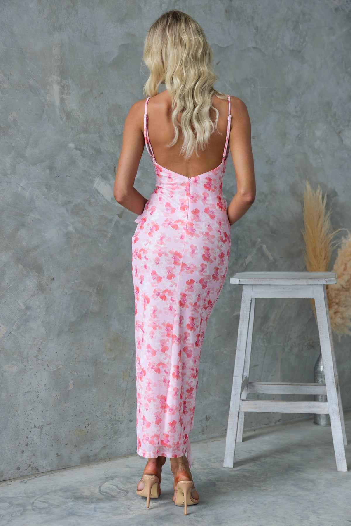 Back view of Rarmi Maxi Dress, featuring adjustable straps and pink floral pattern, perfect for summer occasions.