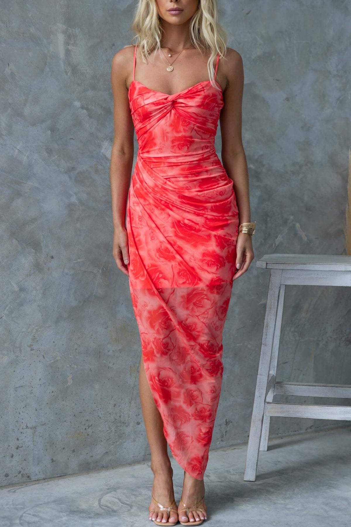 Saloni Maxi Dress in vibrant red with twist detail, adjustable straps, and asymmetric hemline, perfect for special occasions.
