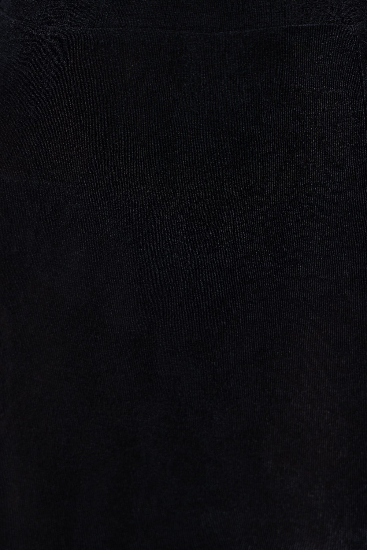 Close-up view of black fabric texture from Burnette Top, showcasing its soft, stretchy material.