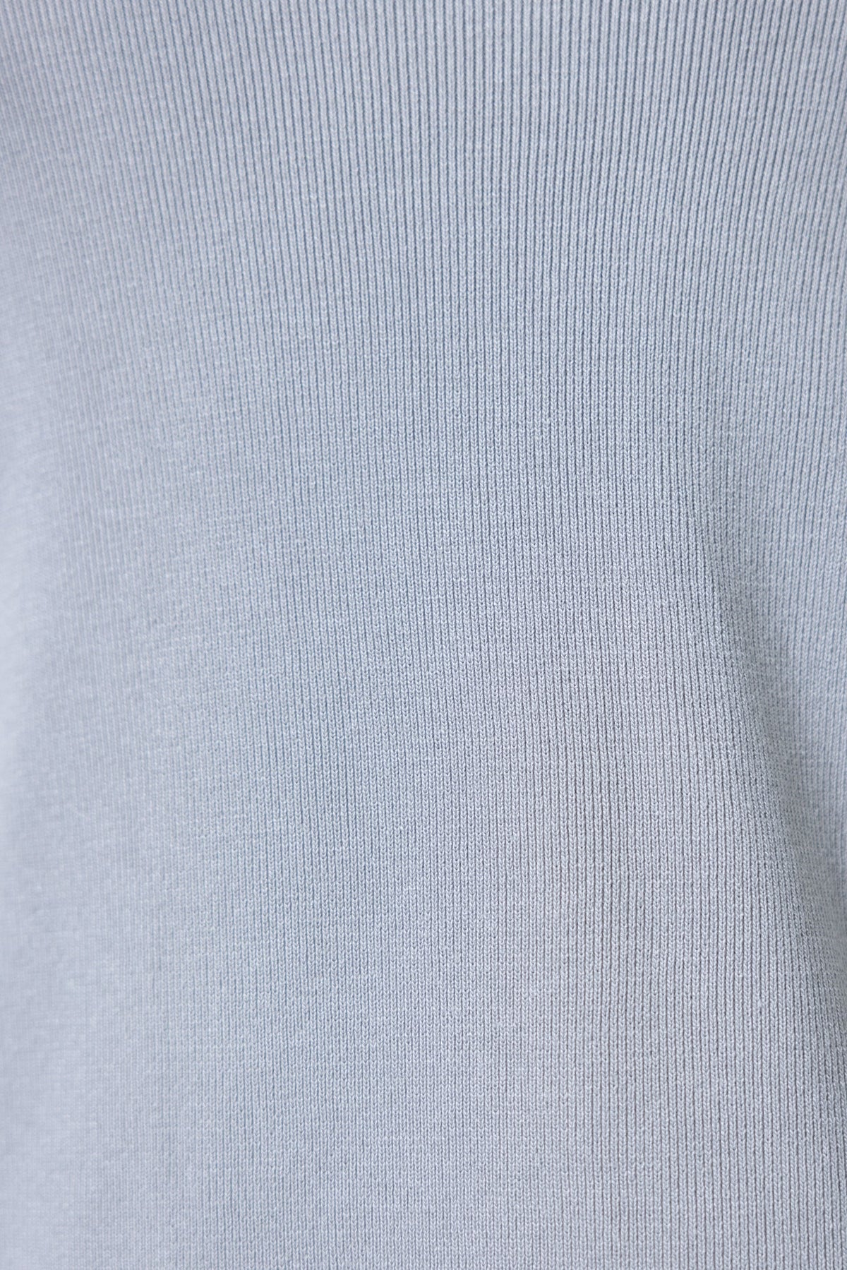 Light blue fabric texture of the Acaia Cardigan, featuring a soft ribbed design suitable for versatile styling.