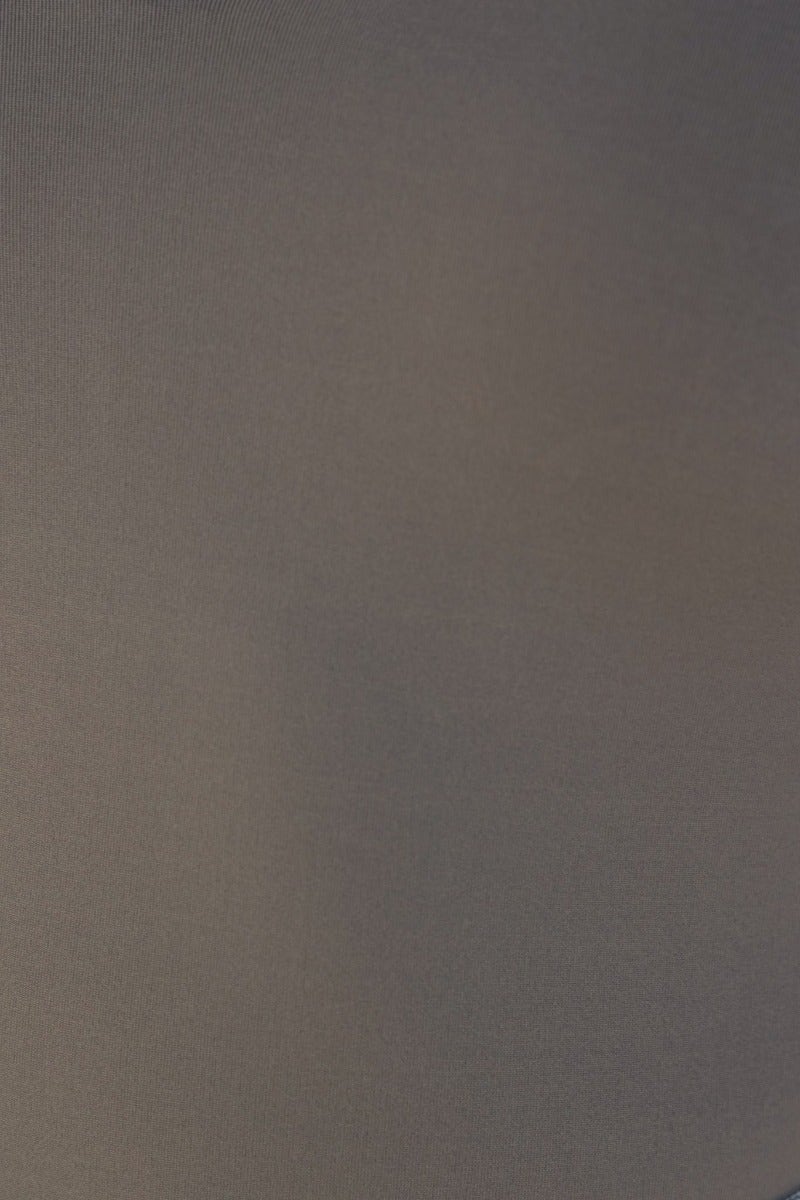 Close-up of textured fabric in a muted gray tone, ideal for stylish bodysuits and seamless garments.