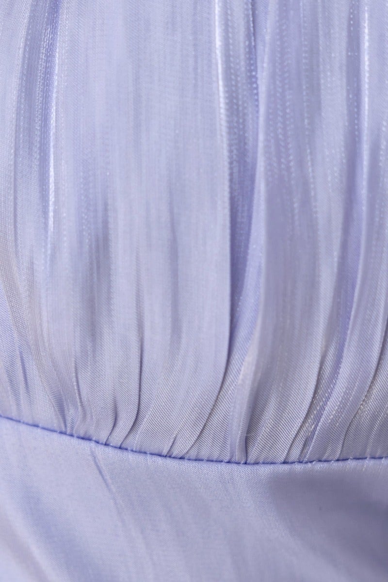 Detail of the Greta Top in lilac satin, showcasing the elegant pleats and soft texture of the fabric.