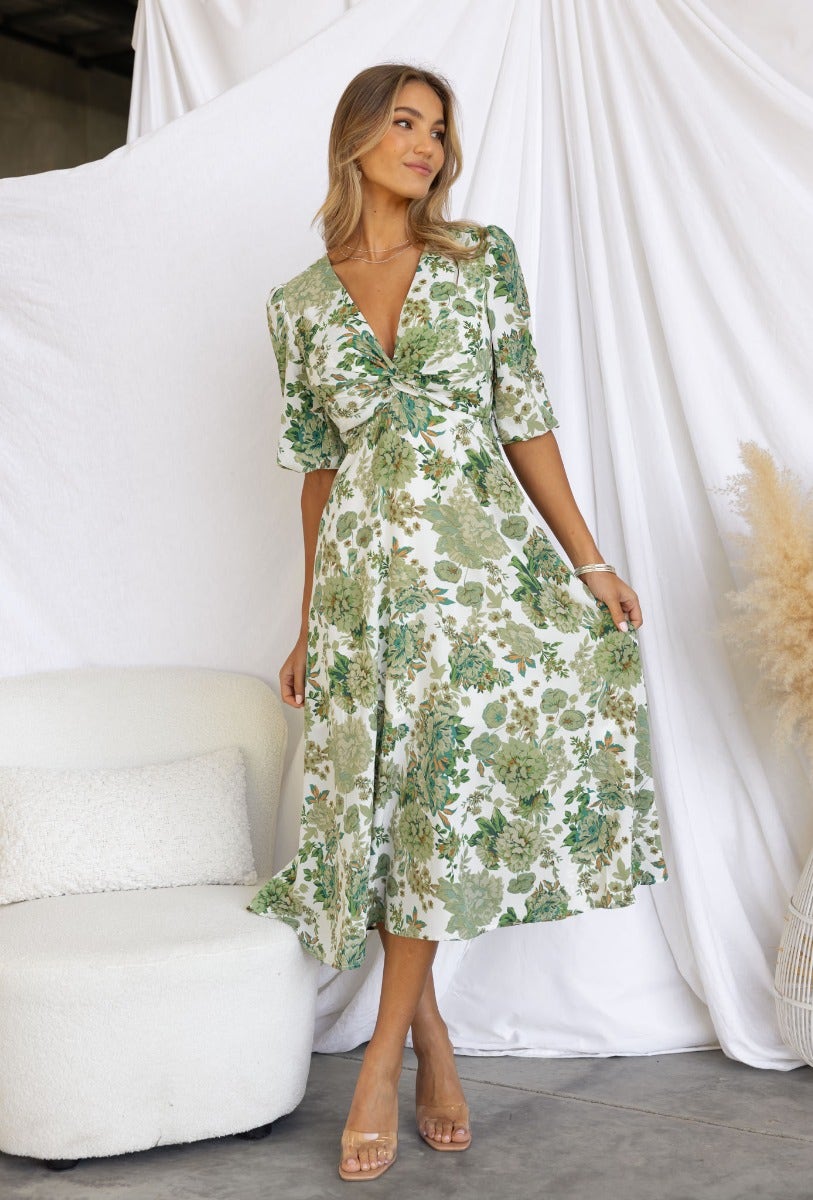 Floral print Corria Midi Dress with twist detail, featuring elastic sleeve cuffs and invisible side zip.