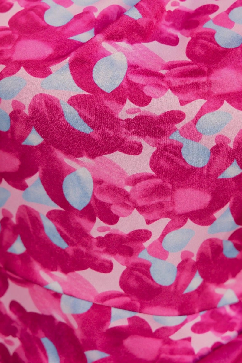 Close-up of a colorful pink and blue abstract print fabric used for the Cordelia dress, showcasing its vibrant design.