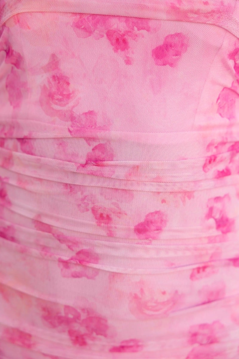 Close-up of the Universe Midi Dress featuring a pink mesh overlay with floral patterns and stylish ruching.