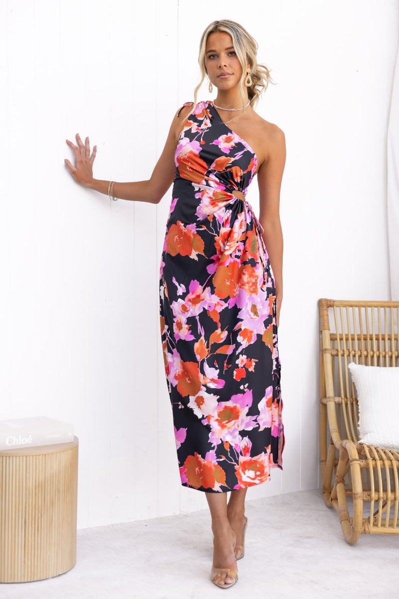 Black floral maxi dress with one-shoulder neckline and adjustable ruching, perfect for summer occasions.