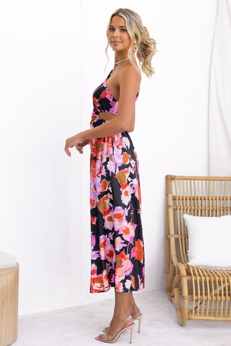 Black floral print Ronan maxi dress featuring a one-shoulder neckline and adjustable ruching, perfect for elegant occasions.