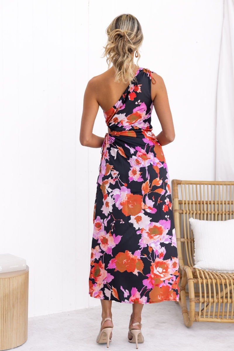 Ronan Maxi Dress with black floral print, one-shoulder neckline, and adjustable ruching, featuring a side split design.