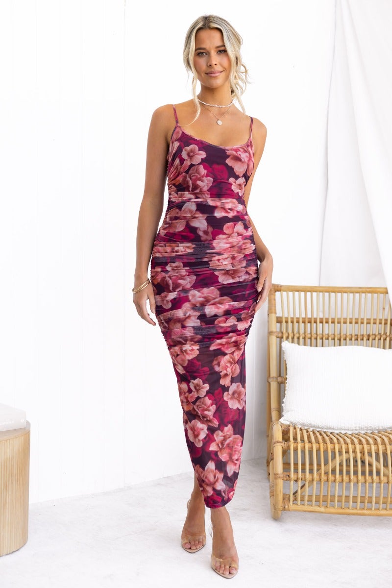 Floral print Break Free Maxi Dress with mesh overlay, adjustable straps, and back split, modeled by a woman.