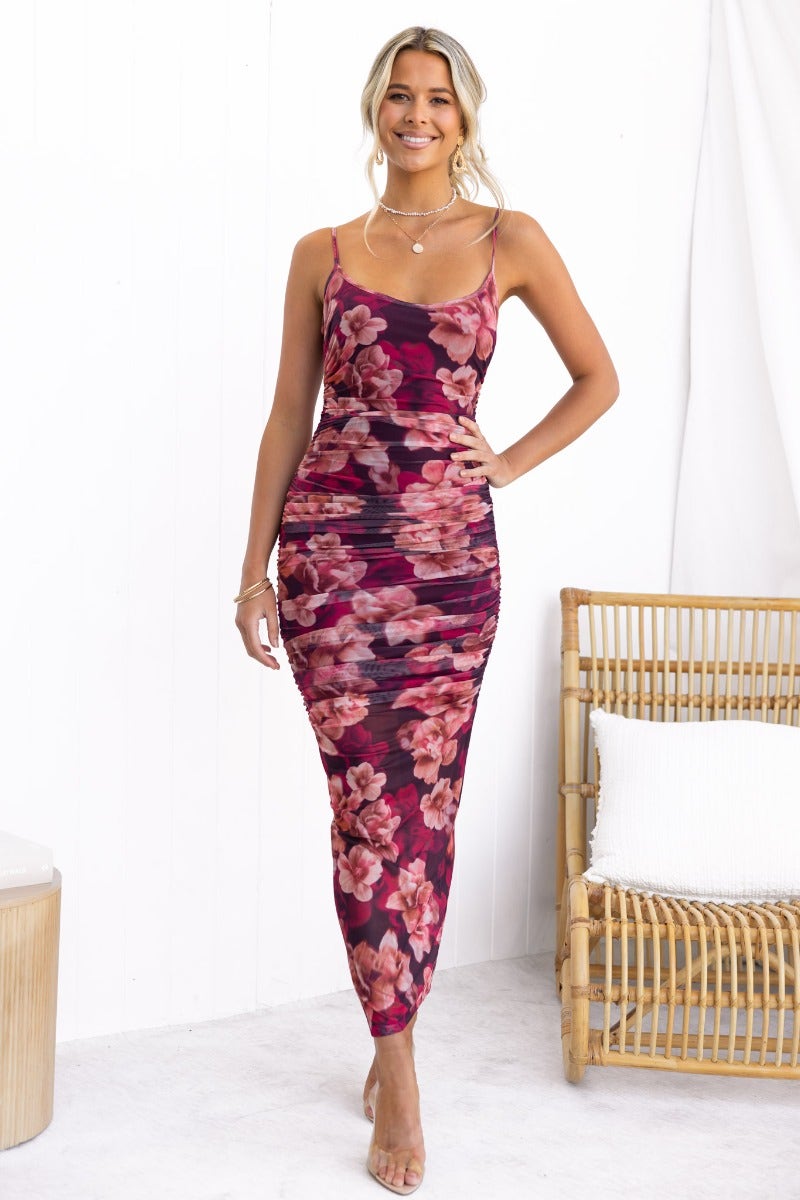 Model wearing Break Free floral print maxi dress with adjustable straps and back split