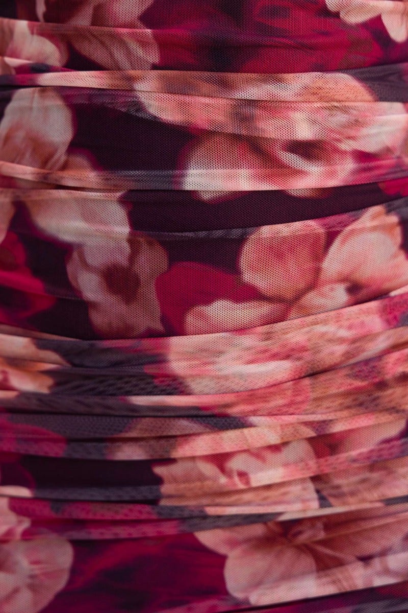 Close-up of floral print fabric with ruching details from the Break Free Maxi Dress.