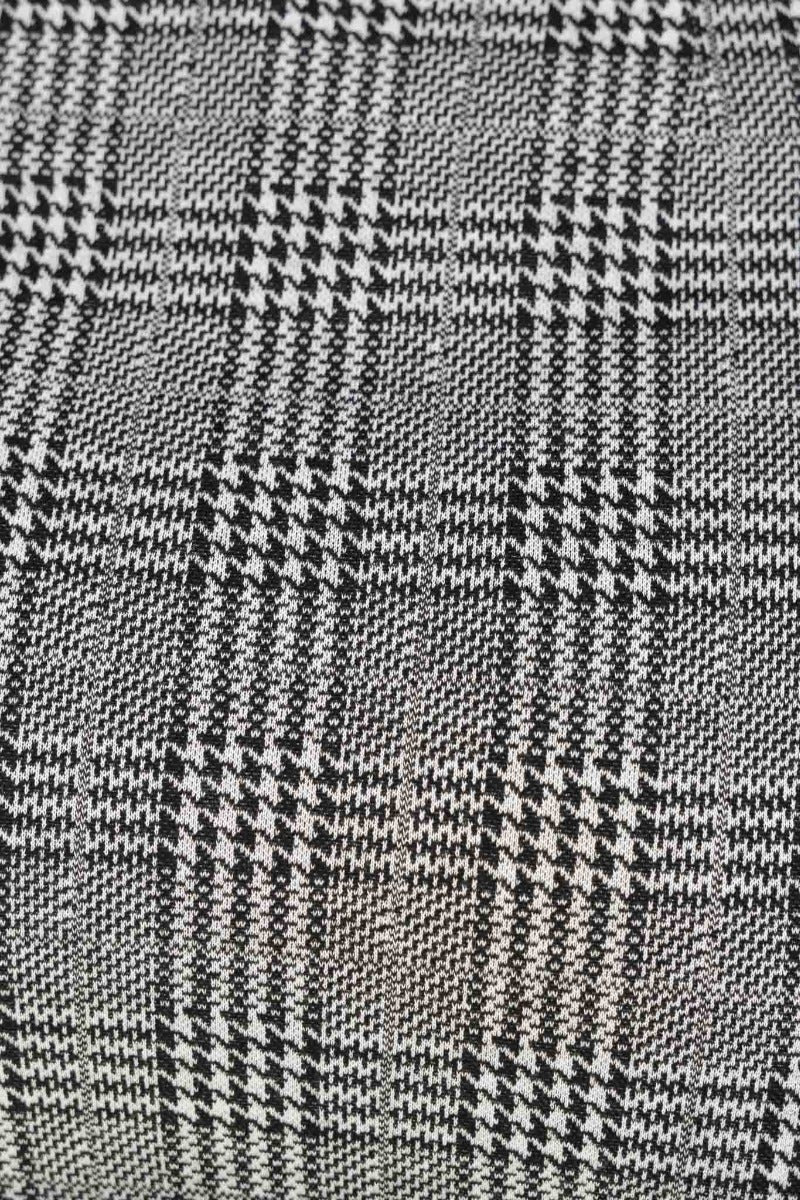 Close-up of houndstooth fabric in black and white, showcasing the woven pattern for Thelma Skirt.