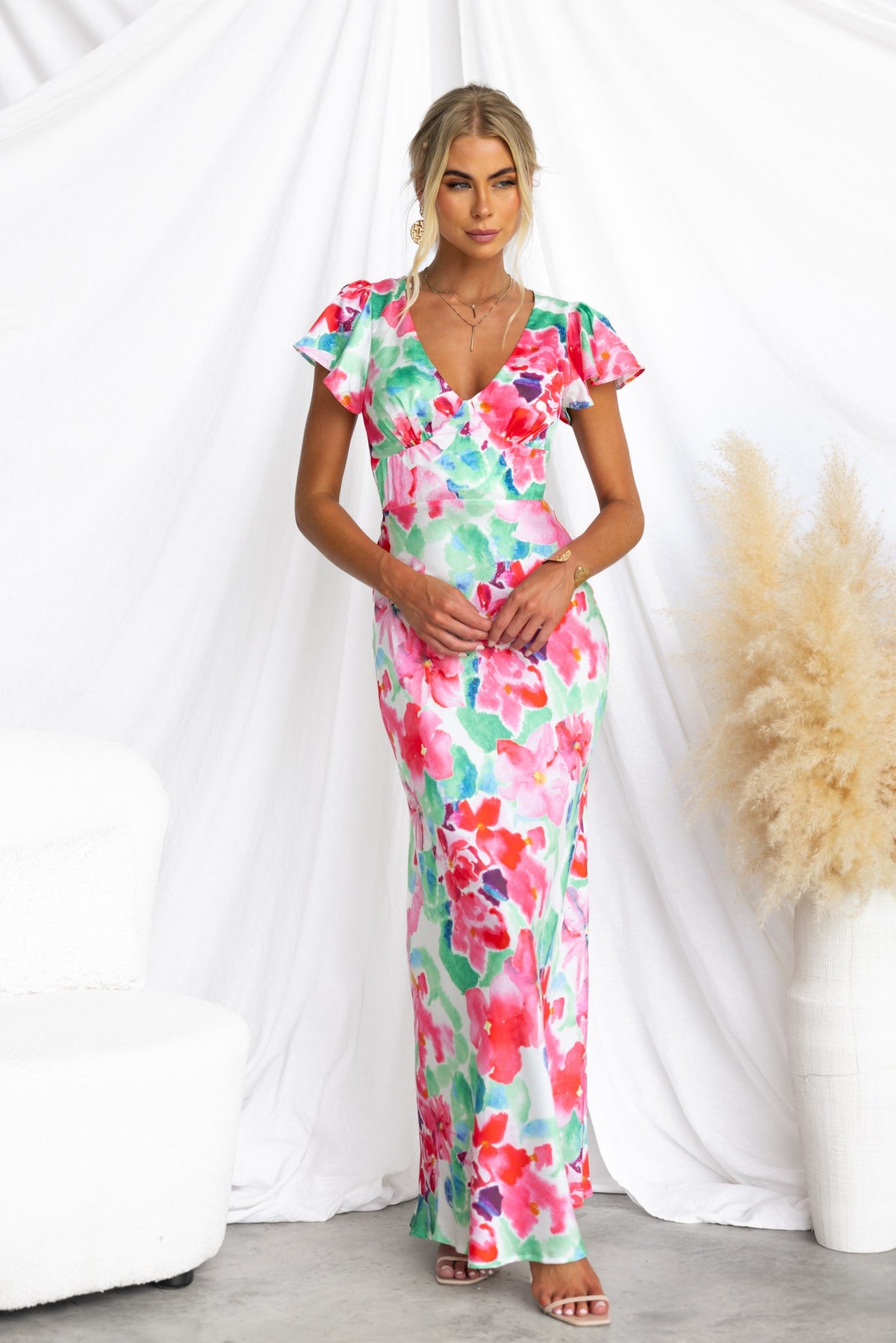 Belmont Maxi Dress featuring cap sleeves and floral print. Elegant satin design with a fitted silhouette.