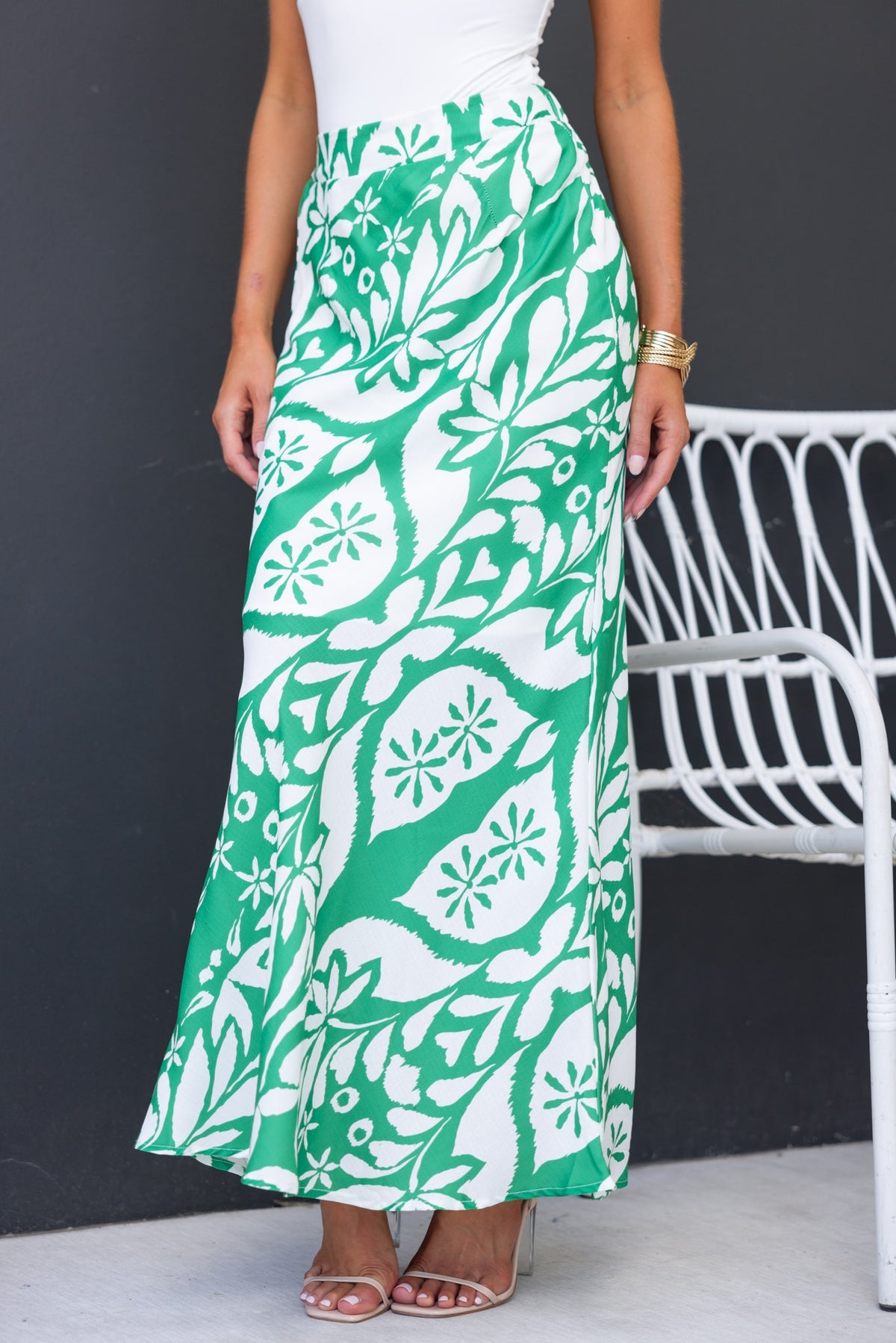 Floral print Sami maxi skirt in green and white, featuring mid-high waist and elastic back of waistband, styled with a top.