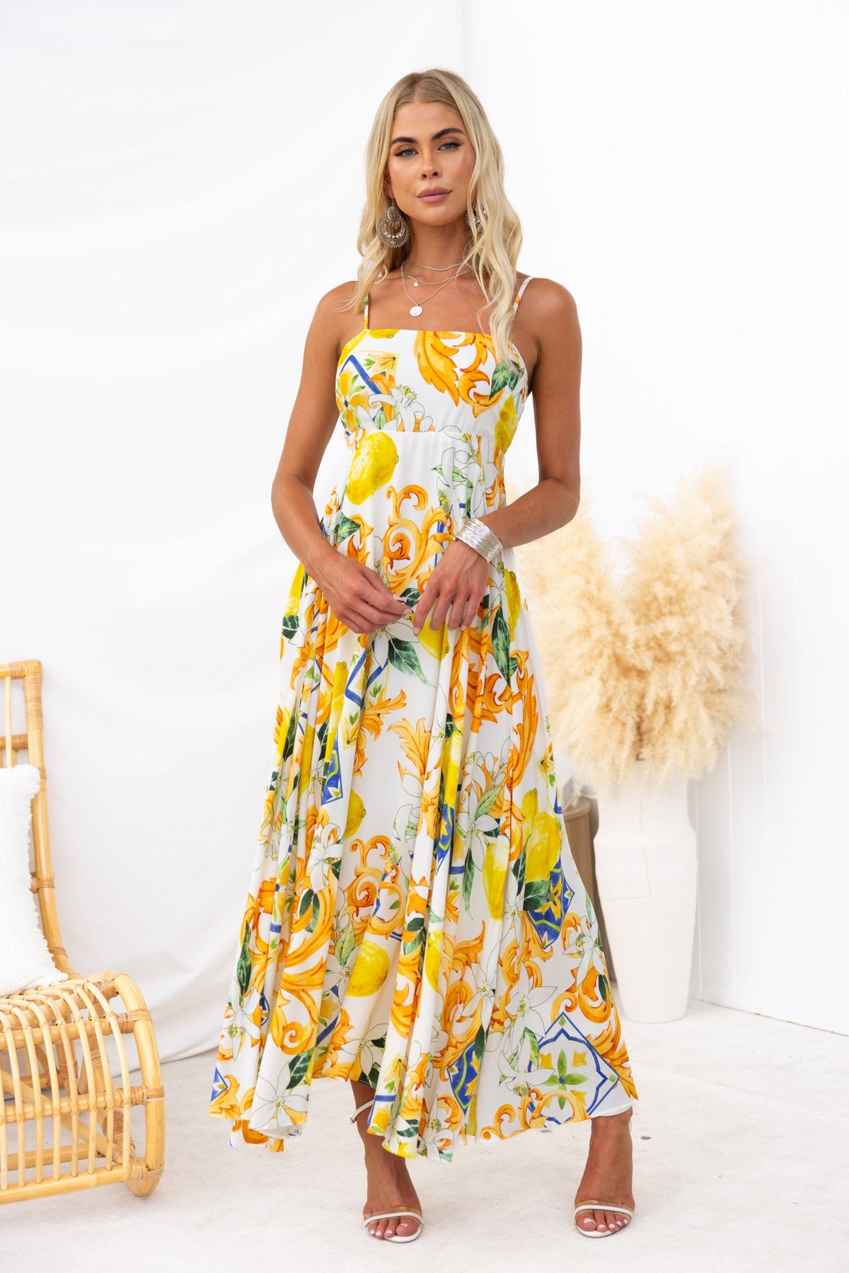 Model wearing Summer Crush Maxi Dress featuring vibrant abstract print and adjustable straps.
