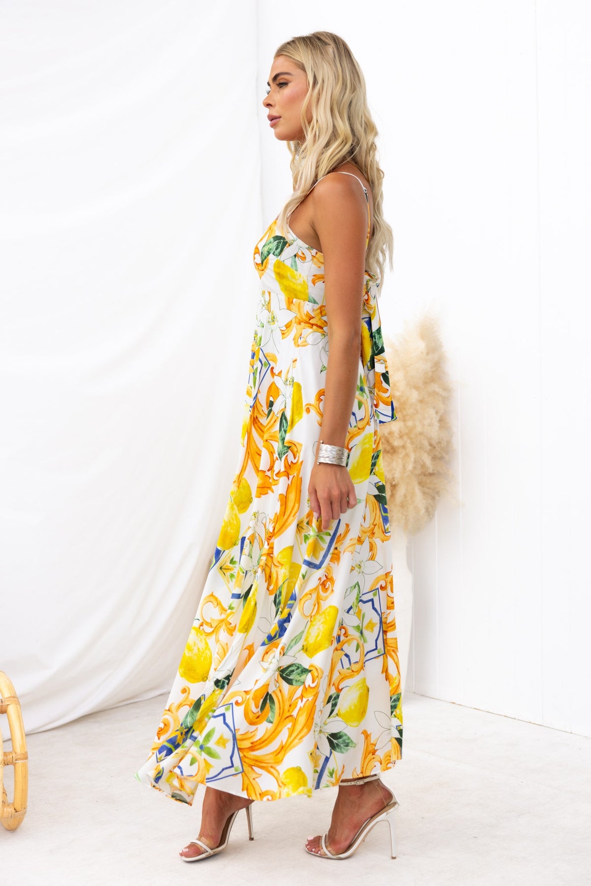 Summer Crush Maxi Dress in vibrant abstract print with adjustable straps, worn by a model, perfect for summer outings.