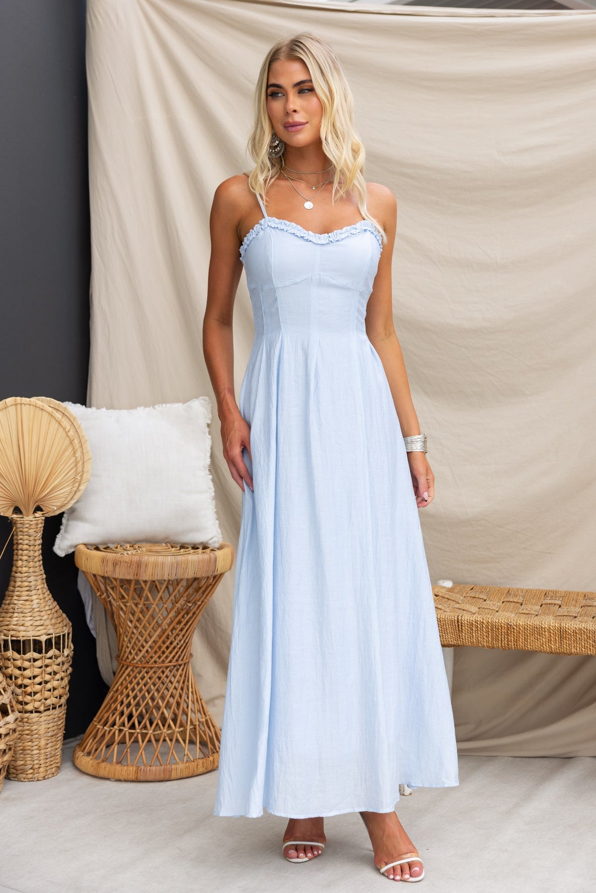Elettra Maxi Dress in light blue, featuring adjustable straps and a floor-length silhouette, ideal for summer outings.