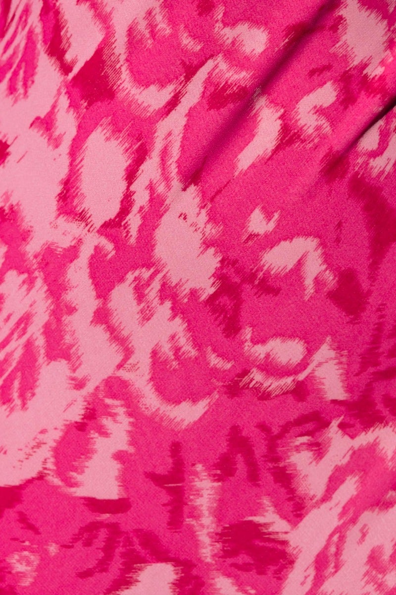 Close-up of vibrant pink floral pattern on Freyda Maxi Dress fabric, showcasing soft texture and colors.