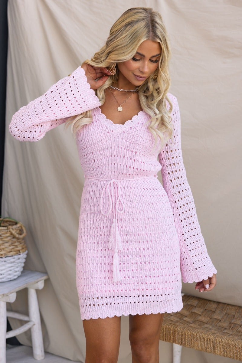 Jadell Dress in soft pink with V-neck, flare sleeves, and removable tie, perfect for stylish summer outfits.