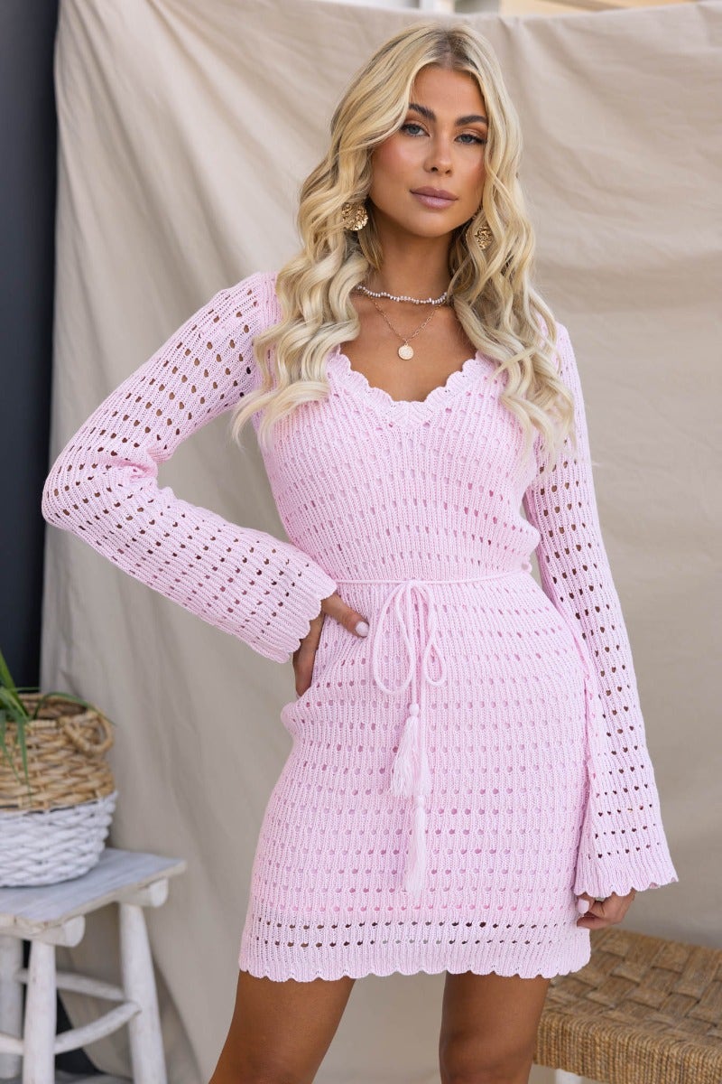 Jadell Dress in pink knit, featuring V-neckline, flare sleeves, and removable fabric tie, designed for a standard fit.