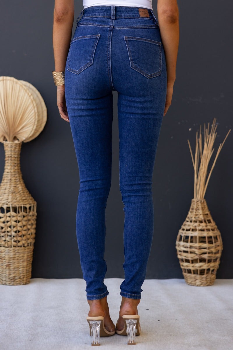 Model wearing Freddy Jeans, mid-high waist denim with front and back pockets, stylish and fitted in blue wash.