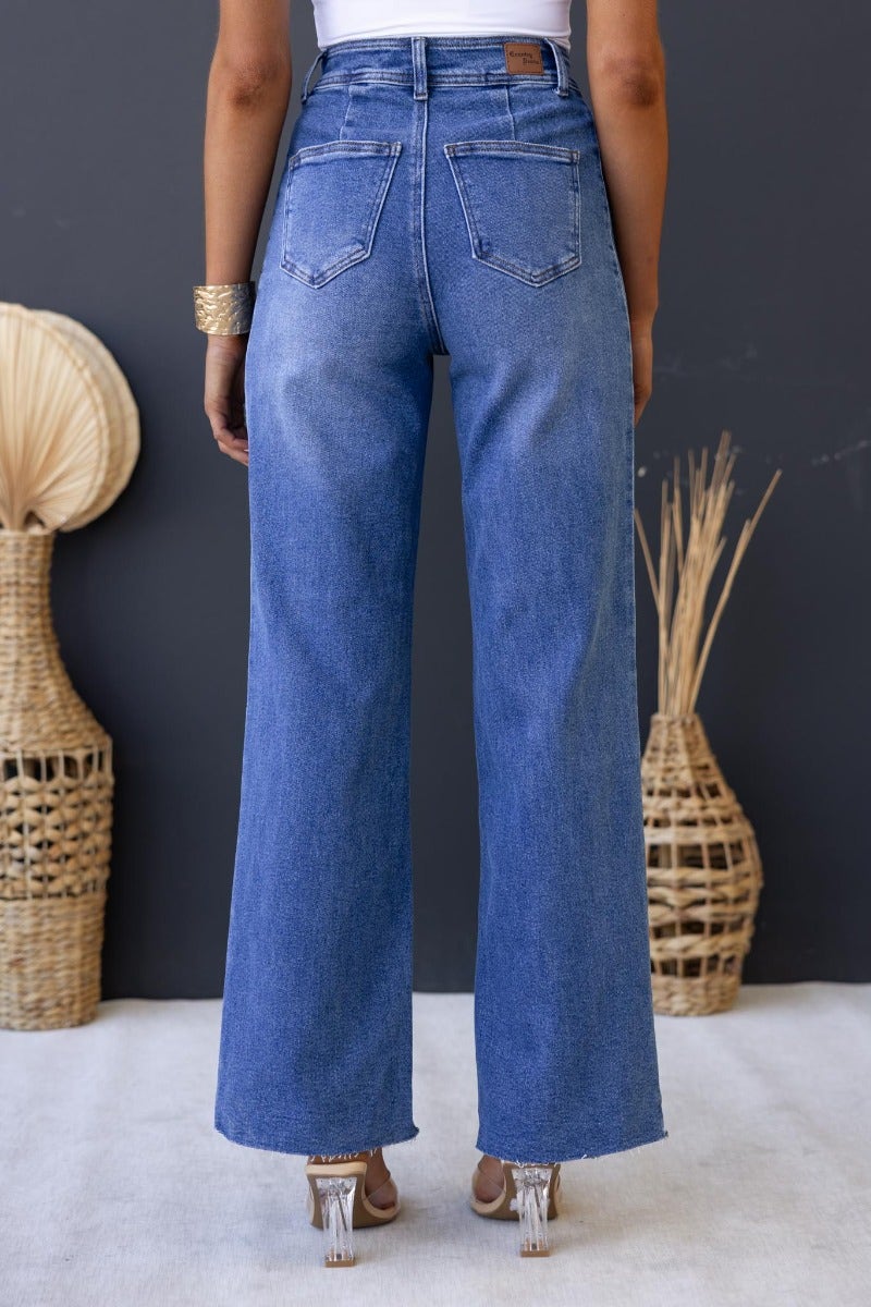 Back view of Timberlake jeans featuring mid-high waist, wide legs, and pockets, styled for a casual look.