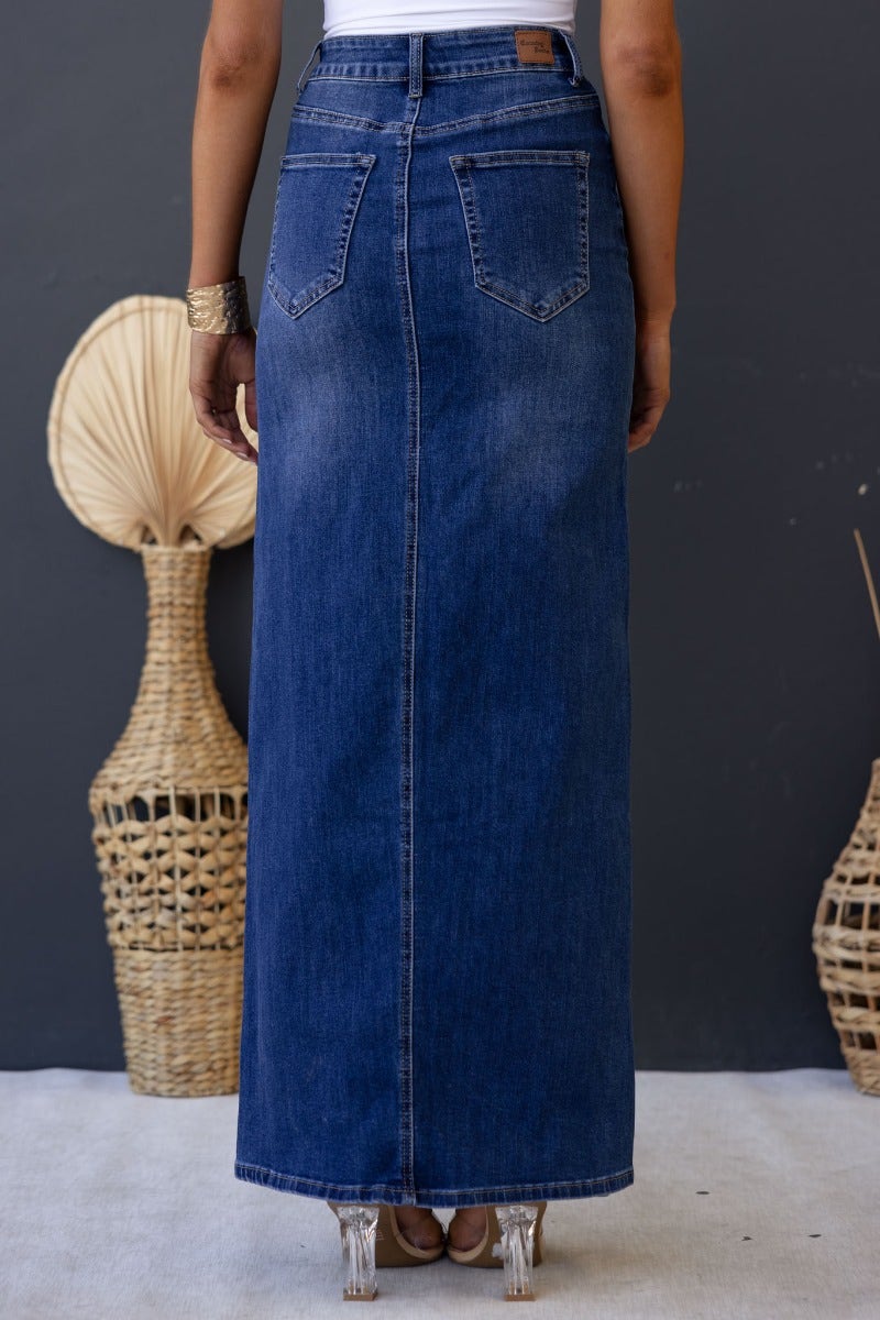 Back view of Xano Denim Maxi Skirt featuring a mid-high waist, pockets, and a fitted design, perfect for casual styling.