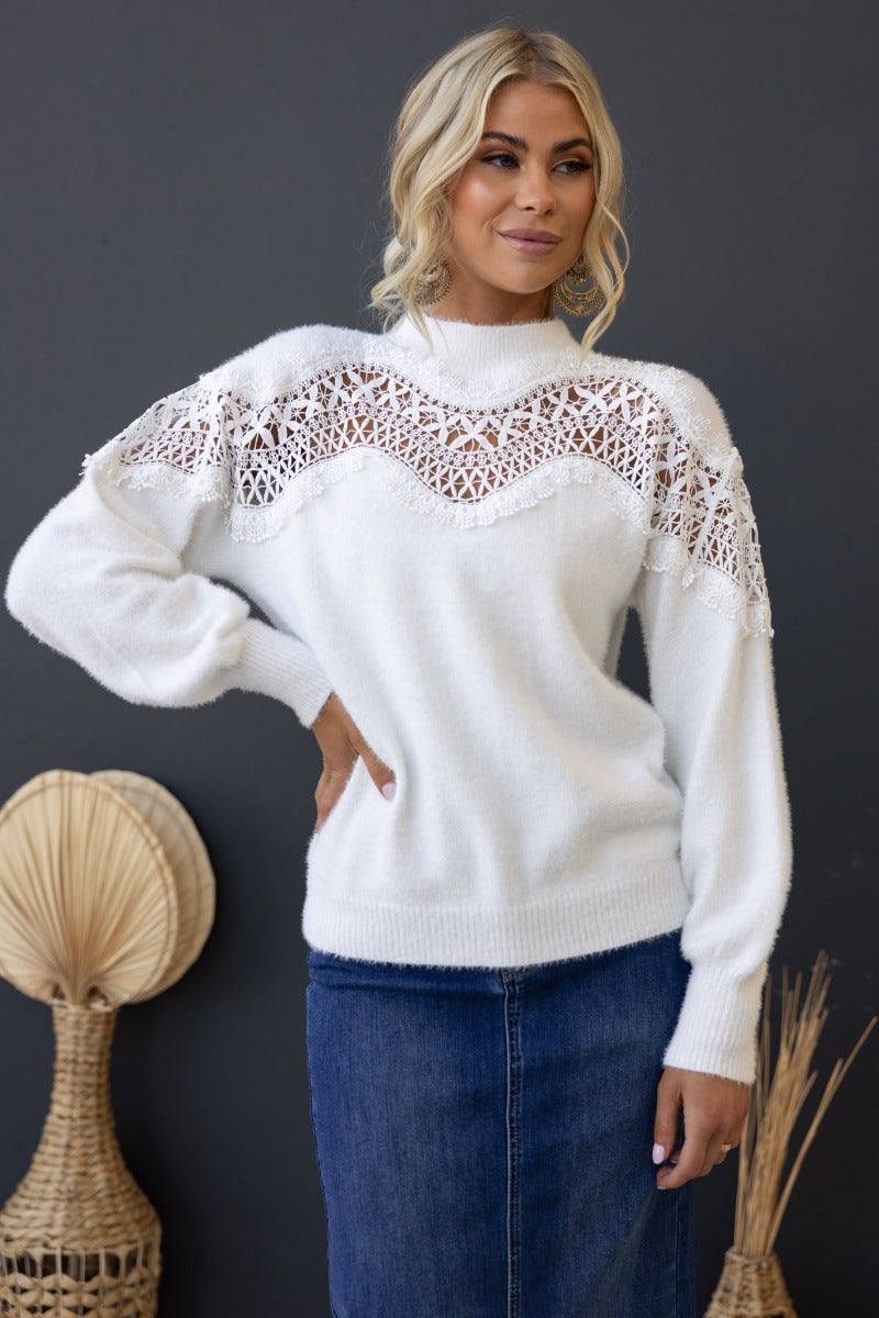 Women's Kyoto Jumper with high neckline and lace detail, featuring a relaxed fit and cozy knit material.