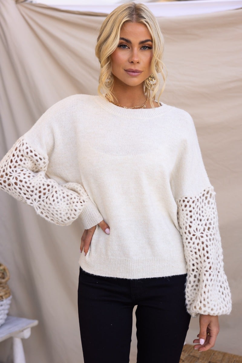 Keilor Jumper featuring a round neckline, open weave knit sleeves, and a relaxed fit in cream color.