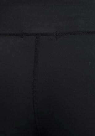 Close-up of black Mally leggings showcasing the mid-high waist and wide waistband design.