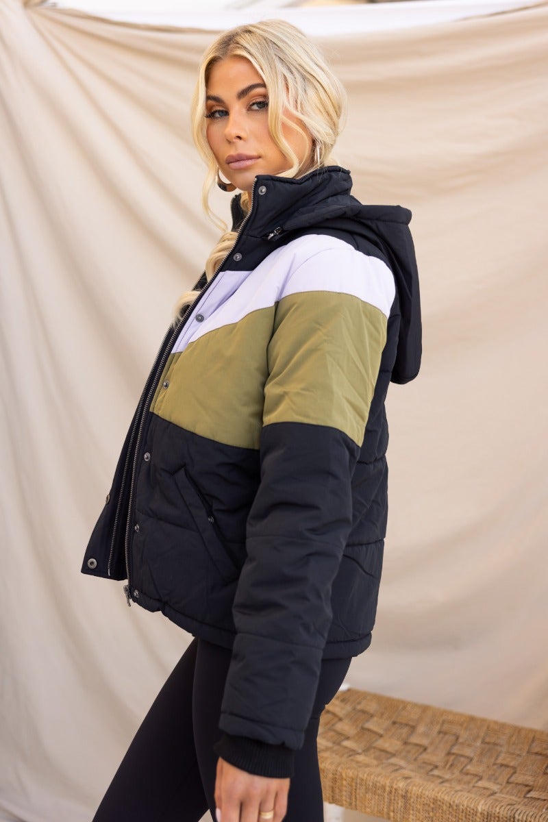 Charis Puffer Jacket in black, green, and white with removable hood, zip front, and pockets, perfect for casual wear.