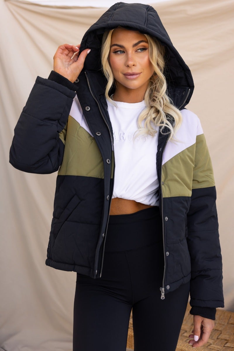 Charis Puffer Jacket featuring a black and green design, removable hood, and zip button-up front, perfect for stylish warmth.