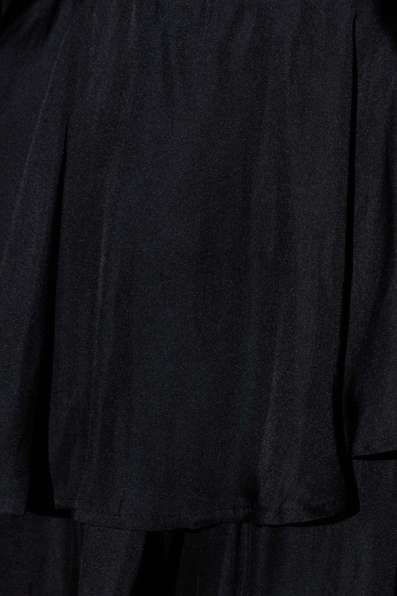 Close-up of the fabric texture of the Helly Black Playsuit, featuring a smooth and elegant polyester material.