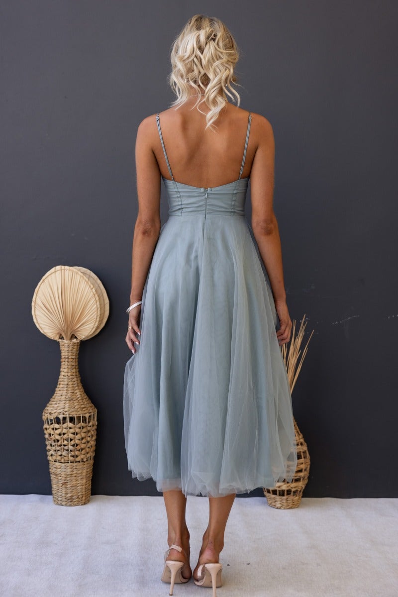 Back view of Genevie Midi Dress in tulle with adjustable straps, padded bust, and boning detail.